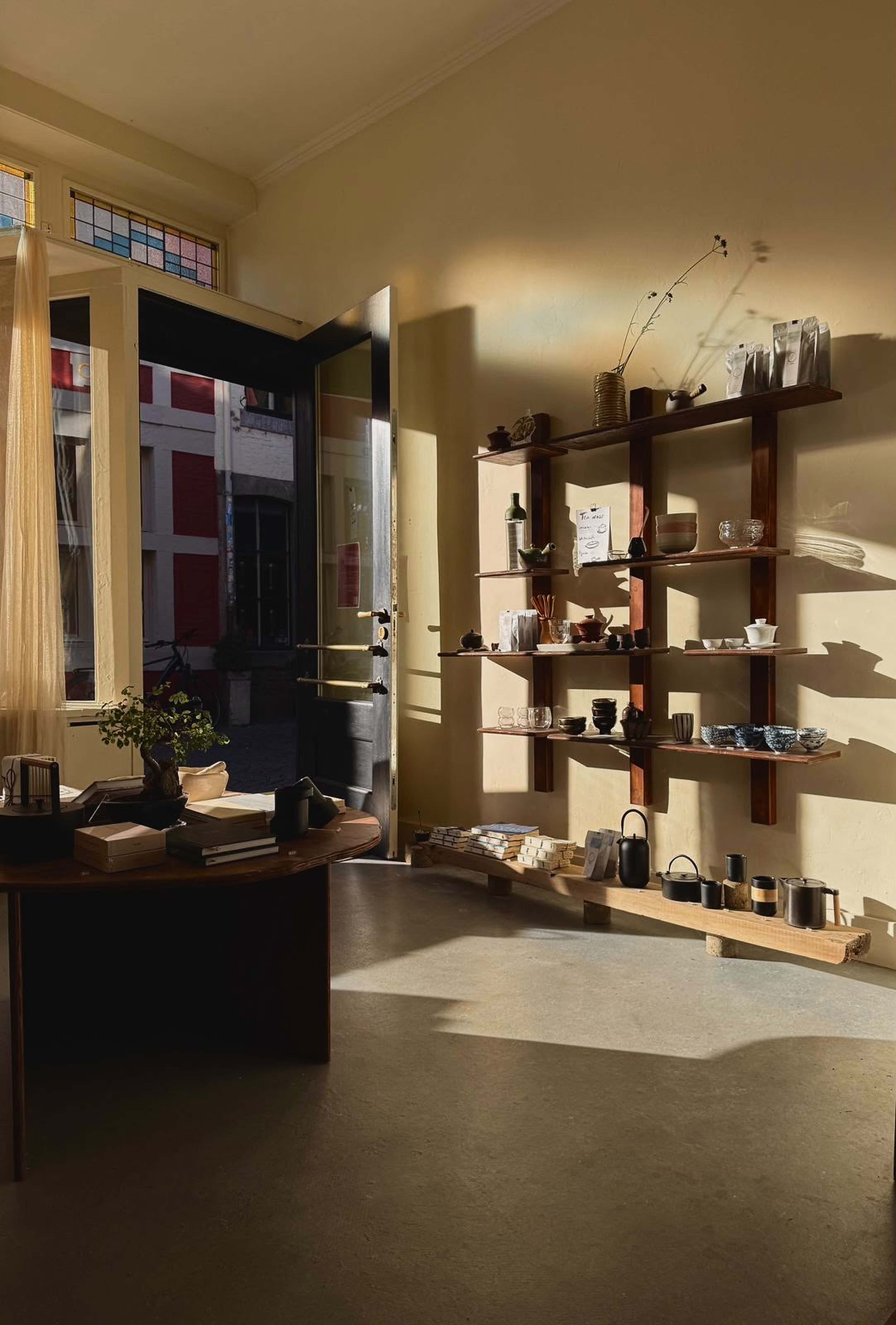 Sunlight falling across the tea shelves at DAO
